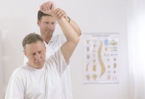 Physiotherapy: Senior man and physiotherapist